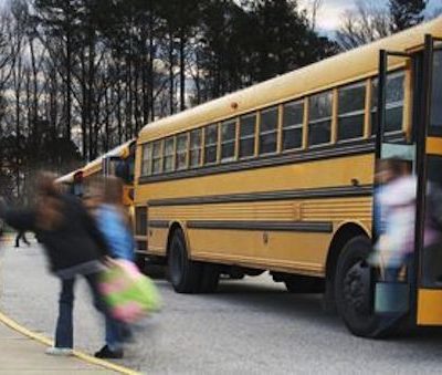 children getting off a school bus