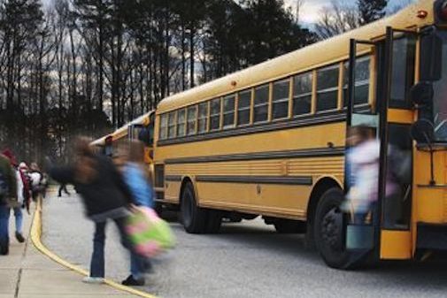 children getting off a school bus