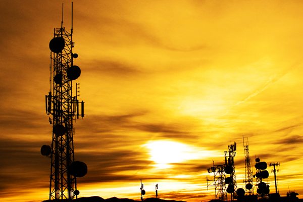 cell phone tower at sunset