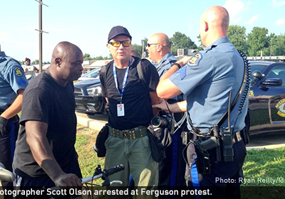 Getty photographer Scott Olson arrested at Ferguson protest.