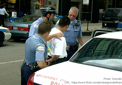 A man being arrested via ACLU.org