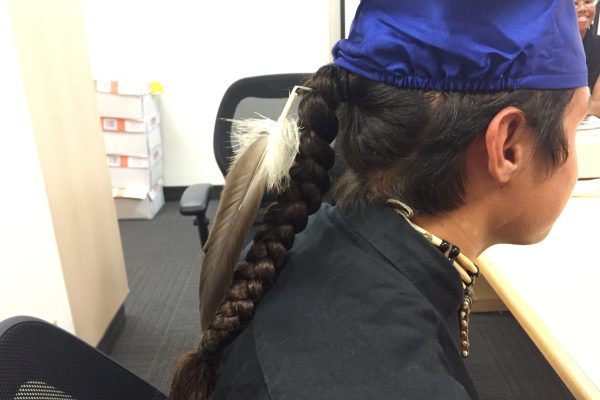 Eagle feather with graduation cap