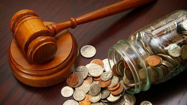 Coins in a jar with a gavel