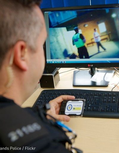 policeman looking at body cam footage