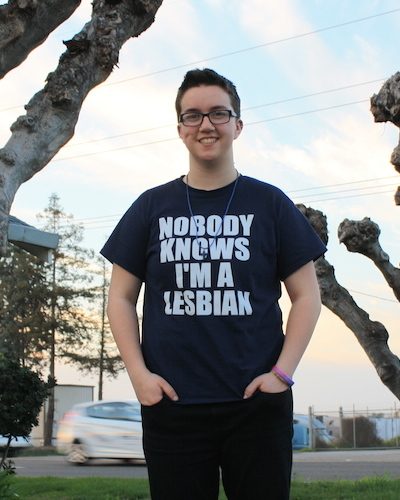 ACLU client Taylor Victor wearing t-shirt that reads "Nobody Knows I'm a Lesbian"