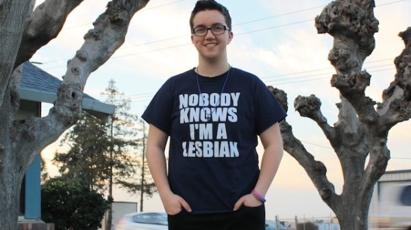 ACLU client Taylor Victor wearing t-shirt that reads "Nobody Knows I'm a Lesbian"