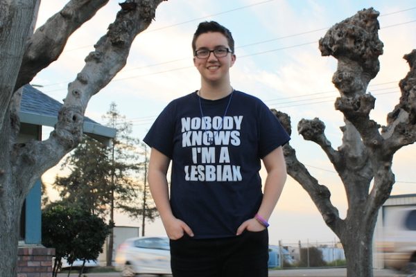 ACLU client Taylor Victor wearing t-shirt that reads "Nobody Knows I'm a Lesbian"