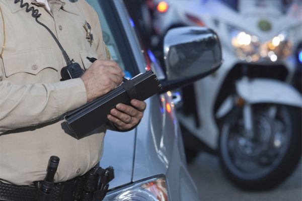 police officer writing a ticket