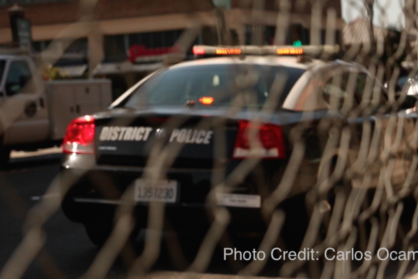Police car with writing on the trunk that reads District Police
