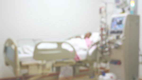 person in hospital bed