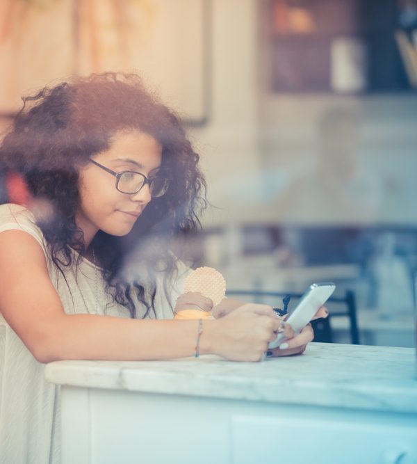 youth looking at a cell phone
