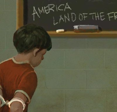 kid in handcuffs in a classroom