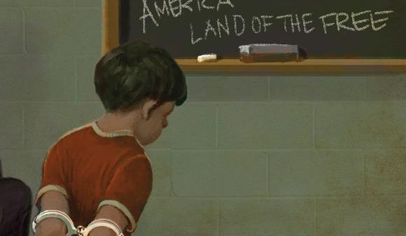 kid in handcuffs in a classroom