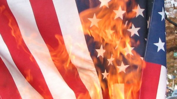 United States flag being burnt in protest, in New Hampshire on the eve of the 2008 election.