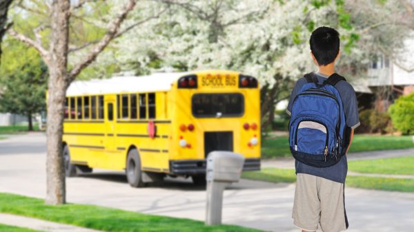 student waiting for bus