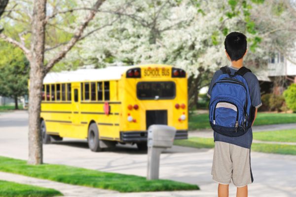 student waiting for bus