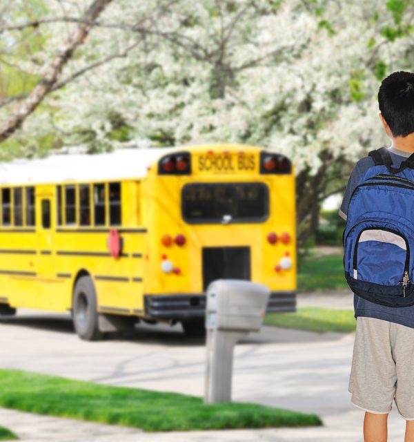 student waiting for bus