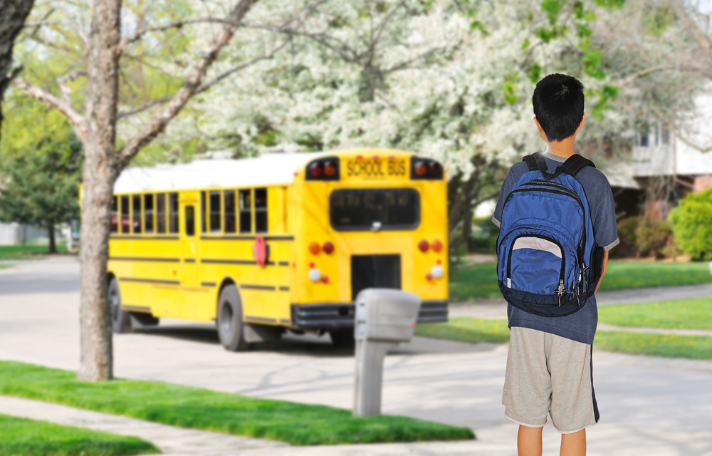 student waiting for bus