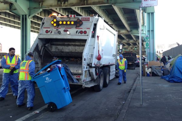 Caltrans truck at homeless encampment