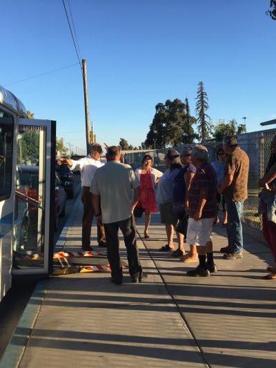 West Park residents gather outside the bus on the day it debuted
