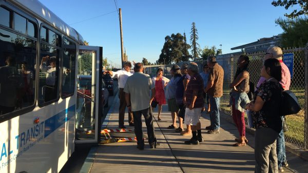West Park residents gather outside the bus on the day it debuted