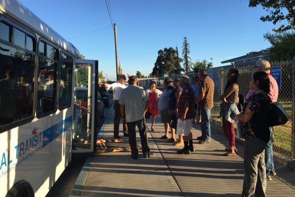 West Park residents gather outside the bus on the day it debuted