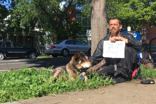 Client Faygo Clark with his sign