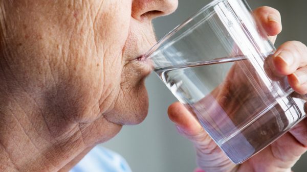 shutterstock image of person drinking water