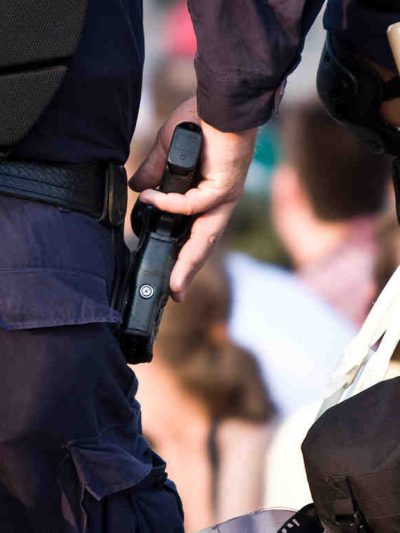 police officer reaching for gun