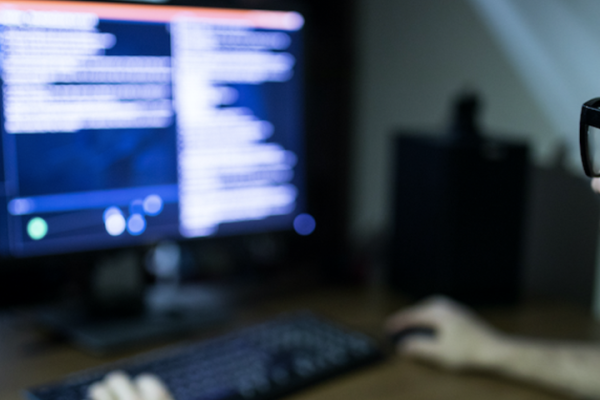 man looking at computer