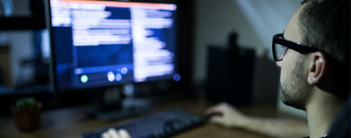 man looking at computer