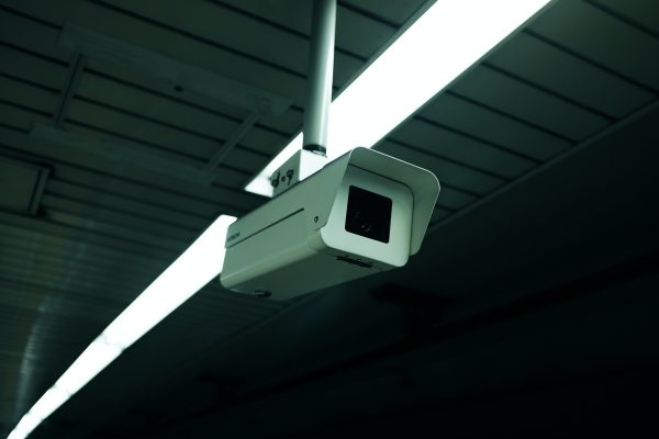 A photograph of a white surveillance camera