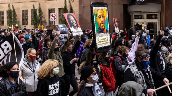 Protesters rally in downtown Minneapolis on the day of the Derek Chauvin murder trial