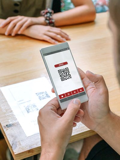 Customer scanning QR code at restaurant