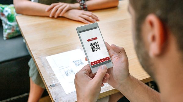 Customer scanning QR code at restaurant