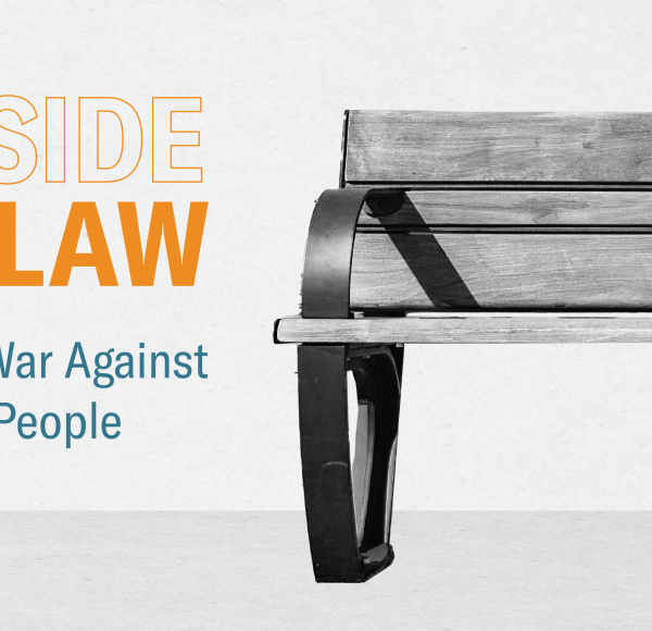 A bench is to the right with text to the left that reads "Outside the Law"
