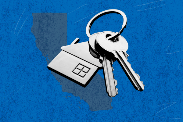 Blue rectangle with a keychain that has a house trinket on it.