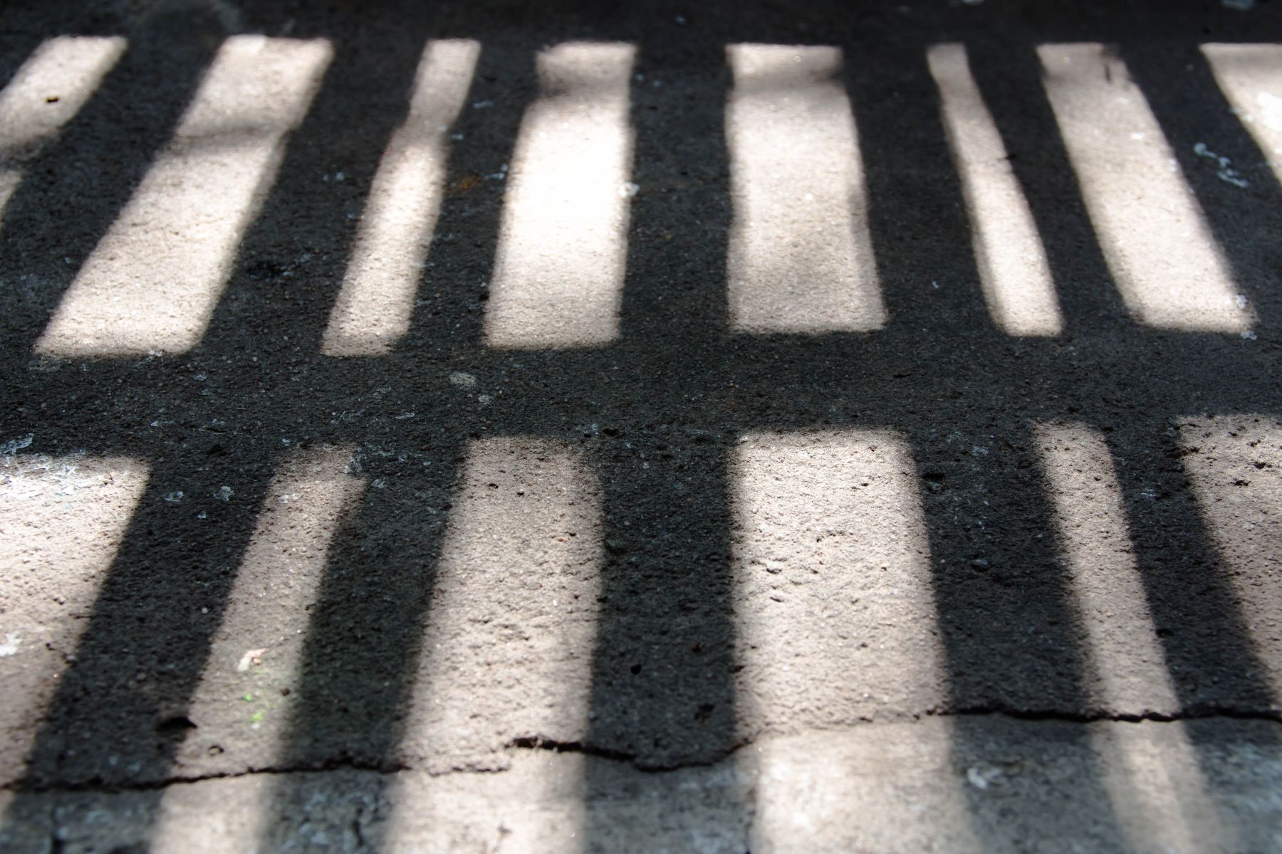 shadow of prison bars on the floor