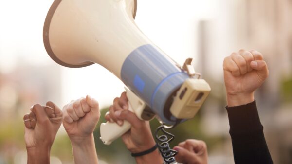 raised fists and megaphone