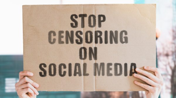sign saying "stop censoring on social media"