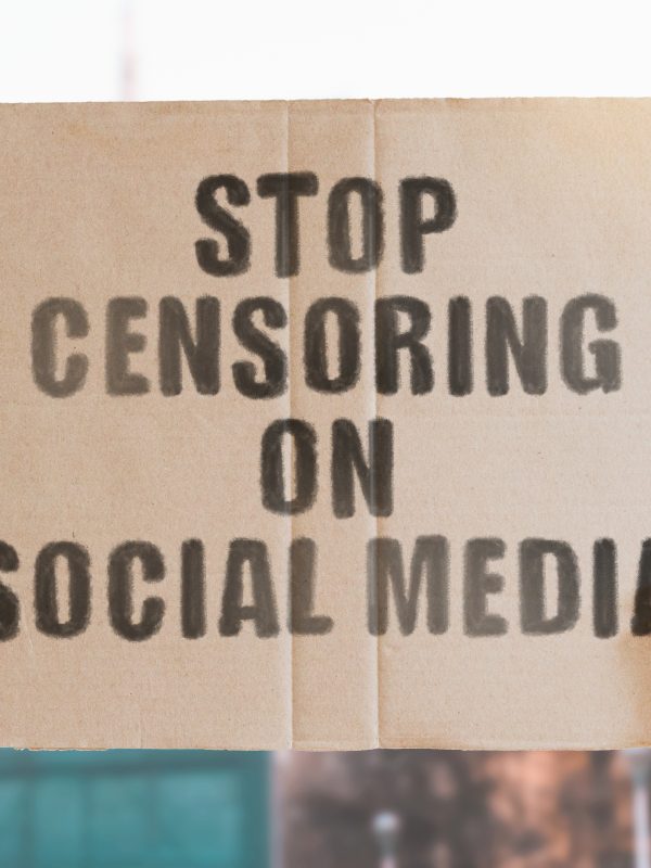 sign saying "stop censoring on social media"