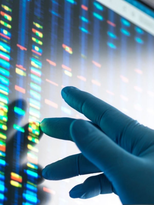 Scientist examining DNA profiles after analytical testing in the lab on a screen monitor