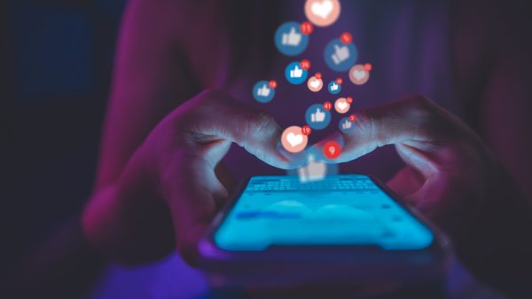 Person using a cell phone for social media