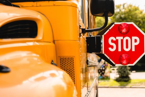 school bus with stop sign popped out