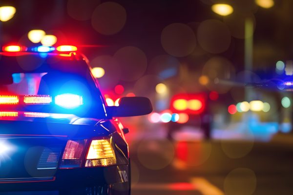 Photo of a police car at night.
