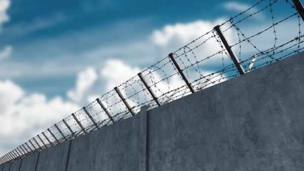 barbed wire on detention facility wall