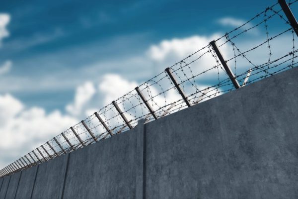 barbed wire on detention facility wall