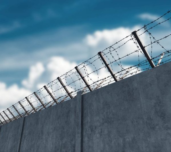 barbed wire on detention facility wall