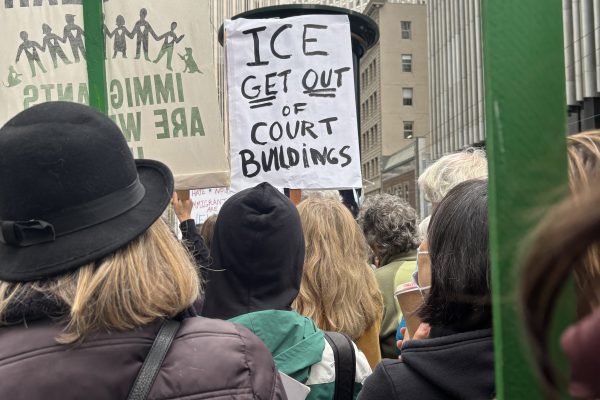 Image of a sign that says, "ICE get out of court buildings."