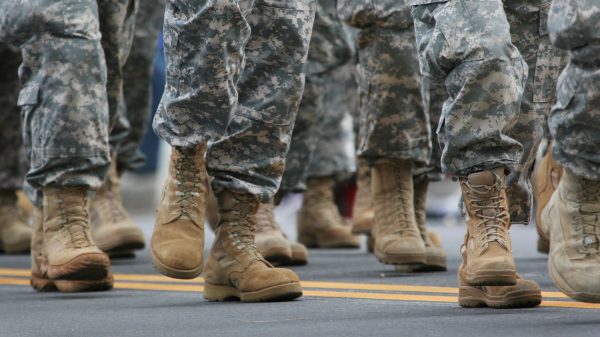 the feet of walking military troops
